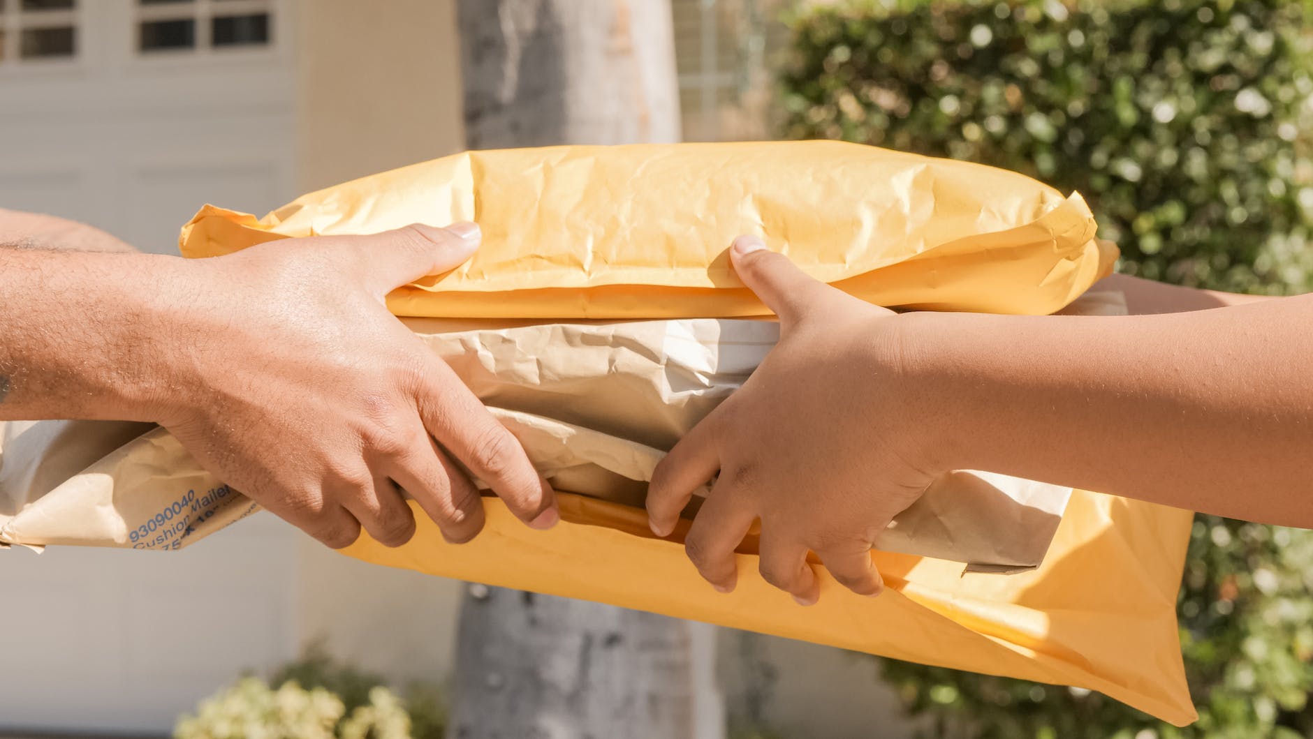 a person handing over delivery packages